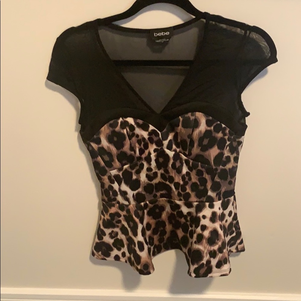 Bebe cheetah print and mesh peplum top.
